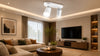 A modern living room featuring a stylish couch, a coffee table, and a flat-screen television on the wall.