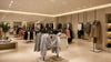 A retail clothing store showcasing a variety of clothes neatly arranged on racks for easy access by customers.